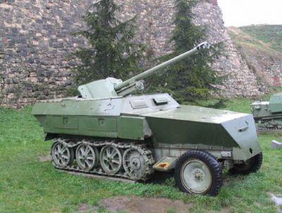 Sdkfz 250/22 with a Russian gun
Photos taken by my brother at Belgrade Army Museum Probably a Russian copy of a Sdkfz 250/22 with a Russian gun - note the very odd wheel arrangement for the tracks maybe marking it out as a non-genuine German 250. Although I have been emailed by Darko Simac from Serbia to say that the odd wheel arrangement is because some of the wheels are missing, and it is in fact a proper German one. Probably the only surviving one in the world. 
